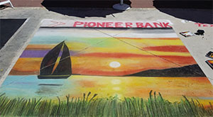 Sailboat at Sunset by Ingrid Kast Fuller for Pioneer Bank at Kerrville Chalk Festival
